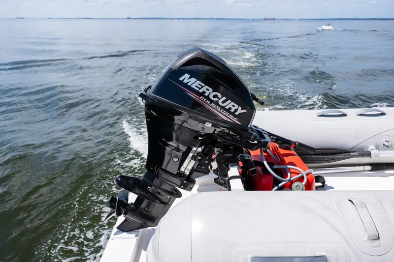 Slide: The Image of Outboard motor on a boat in open water, Symbol 56, 2003 model. - 42