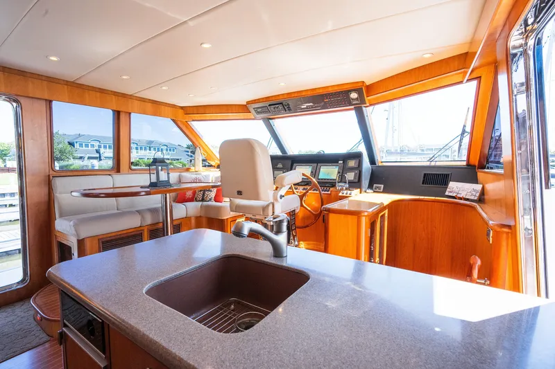 Slide: The Image of Luxurious 2003 Symbol 56 yacht interior with helm, seating, and modern amenities. - 66