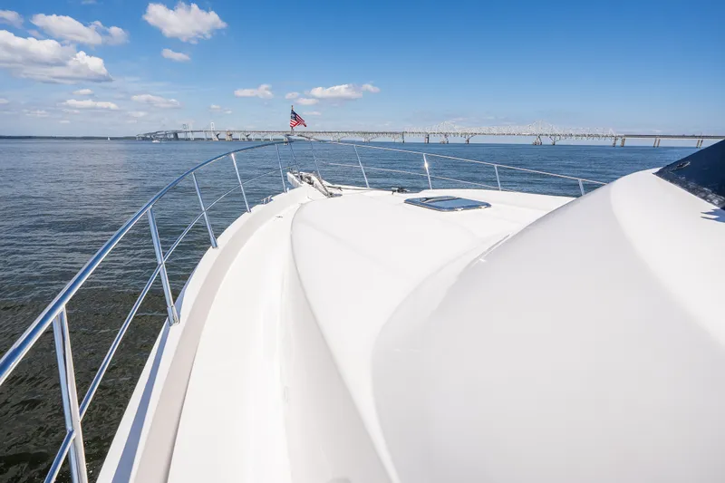 Slide: The Image of Luxury yacht cruising under blue skies near a bridge, Symbol 56 model, 2003. - 20