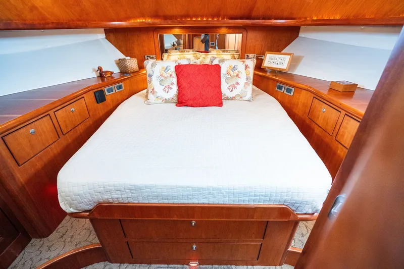 Slide: The Image of Luxurious wooden cabin interior with a cozy bed, Symbol 56 yacht, 2003 model. - 85