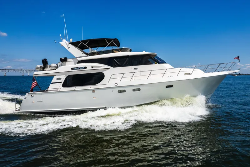 Slide: The Image of Luxury yacht Symbol 56 cruising on open water, 2003 model. - 2