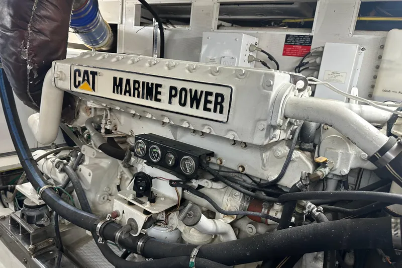 Slide: The Image of CAT Marine Power engine in a 2003 Symbol 56 yacht, showcasing intricate mechanical components. - 65