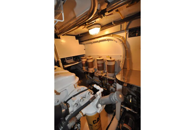 Slide: The Image of Engine room of a 2003 Symbol 56 yacht, featuring filters and mechanical components. - 32
