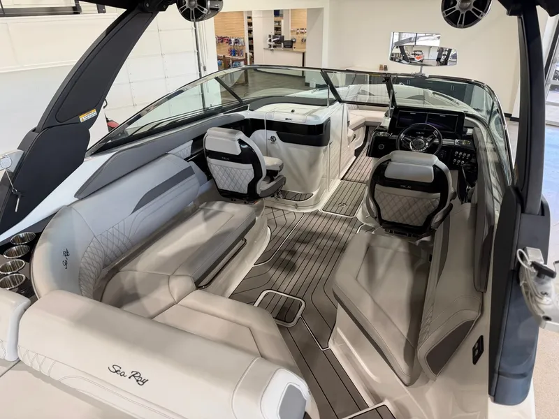 Slide: The Image of Interior view of a Sea Ray SLX 260 Surf boat with sleek seating and modern cockpit. - 16