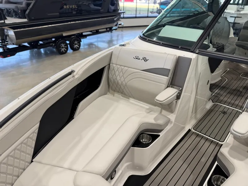 Slide: The Image of The image shows the interior of a 2024 Sea Ray SLX 260 Surf boat with sleek seating. - 28