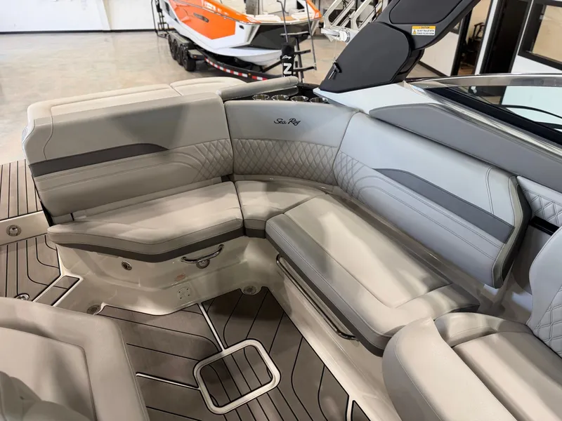 Slide: The Image of Interior view of a 2024 Sea Ray SLX 260 Surf with sleek gray upholstery. - 17