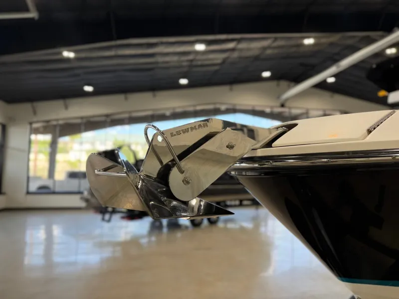 Slide: The Image of Close-up of a 2024 Sea Ray SLX 260 Surf anchor in a showroom setting. - 9