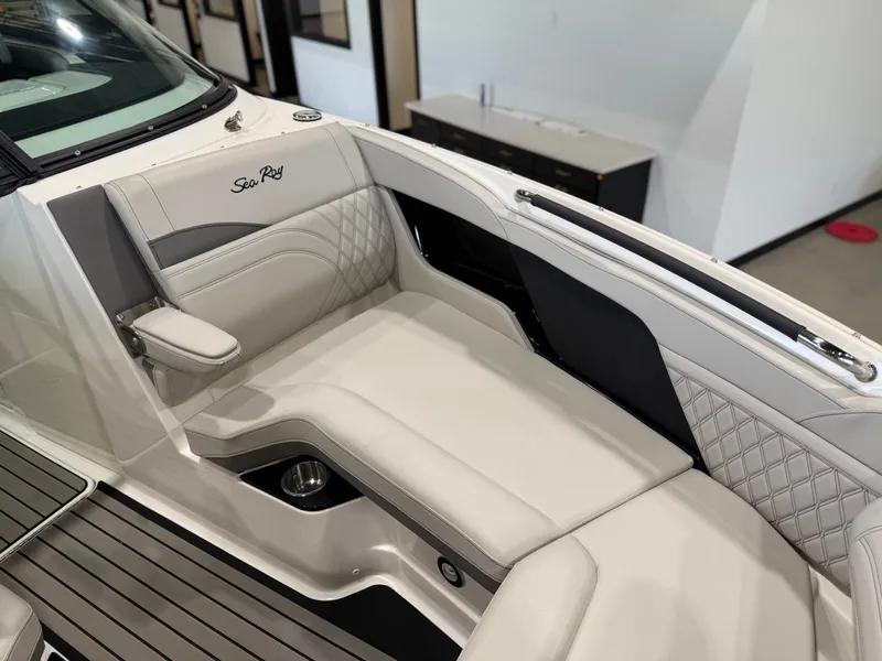 Slide: The Image of The image shows the luxurious cockpit of a 2024 Sea Ray SLX 260 Surf boat. - 29