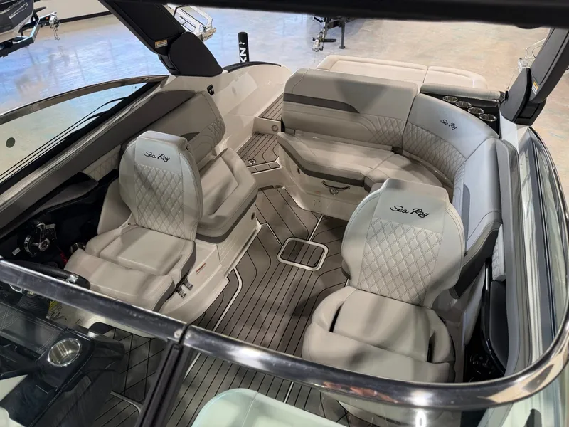 Slide: The Image of Interior of a 2024 Sea Ray SLX 260 Surf boat with sleek seating and modern design. - 30