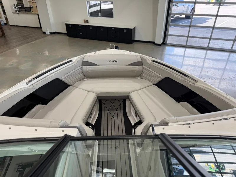 Slide: The Image of Interior view of a Sea Ray SLX 260 Surf boat with sleek, cushioned seating. - 27