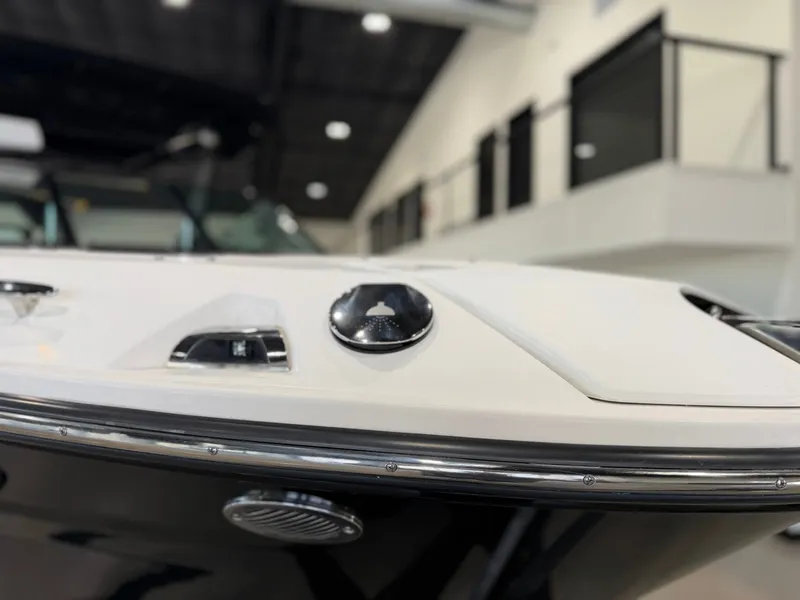 Slide: The Image of Close-up of the bow of a Sea Ray SLX 260 Surf boat in a showroom. - 10