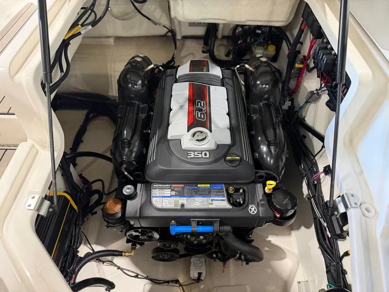 Slide: The Image of The engine compartment of a 2024 Sea Ray SLX 260 Surf with a 6.2-liter engine. - 32
