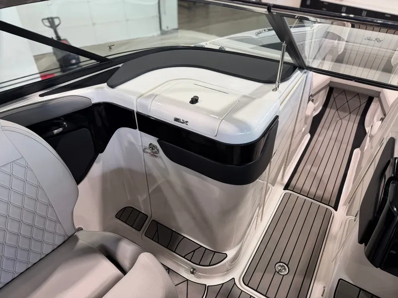 Slide: The Image of The image shows the interior of a 2024 Sea Ray SLX 260 Surf boat with sleek seating. - 20