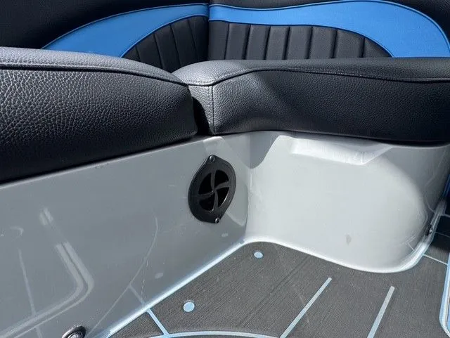 Slide: The Image of Close-up of a boat interior with black and blue seating and a speaker. - 16