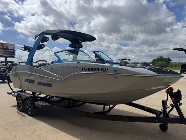 Slide: The Image of A gray 2023 MB SPORTS B52 23 Alpha boat on a trailer under a cloudy sky. - 7
