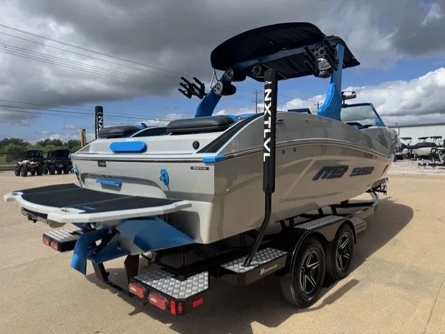 Slide: The Image of A gray and blue sports boat on a trailer, ready for water adventures. - 6