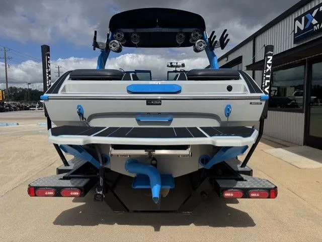 Slide: The Image of 2023 MB SPORTS B52 23 Alpha on a trailer, featuring blue and gray color scheme. - 5