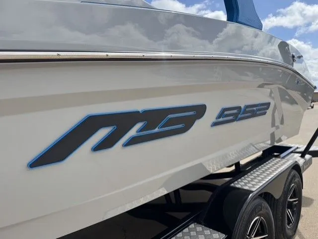 Slide: The Image of Close-up of the MB SPORTS B52 23 Alpha boat on a trailer. - 3