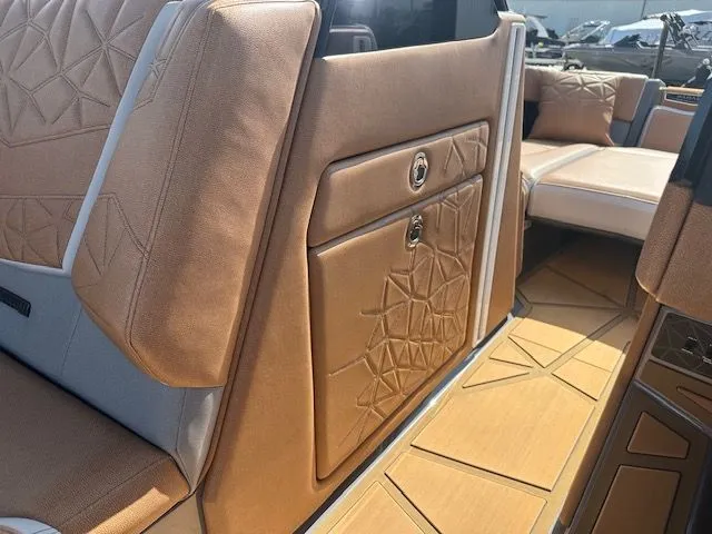 Slide: The Image of Luxurious interior of a 2025 Nautique Super Air Nautique G25 Paragon with elegant, upholstered seating. - 27