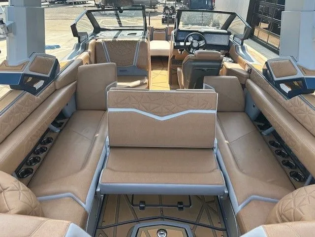 Slide: The Image of Interior of a luxury motorboat with beige upholstery and a modern dashboard. - 20