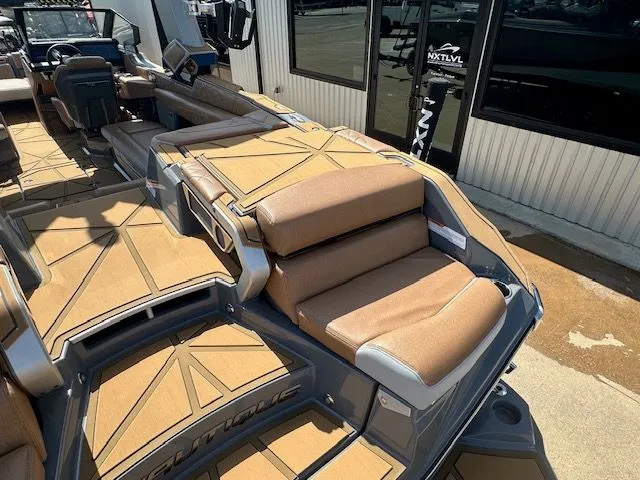 Slide: The Image of The image shows the deck of a Nautique Super Air Nautique G25 Paragon with beige upholstery. - 12