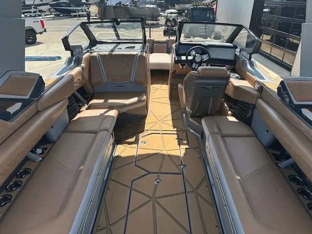 Slide: The Image of Interior of a luxury motorboat with beige leather seating and a modern dashboard. - 19