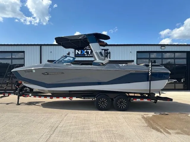 Slide: The Image of A 2025 Super Air Nautique G25 Paragon on a trailer in front of a building. - 9