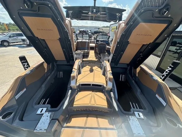 Slide: The Image of The image shows the interior of a Nautique Super Air Nautique G25 Paragon boat with luxurious seating. - 15