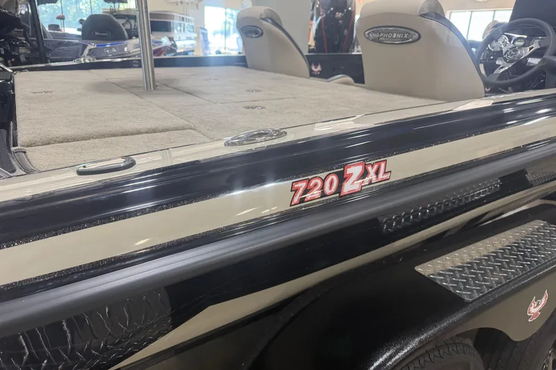Slide: The Image of 2027 Phoenix 721 ZXL boat interior with seating and steering wheel. - 5