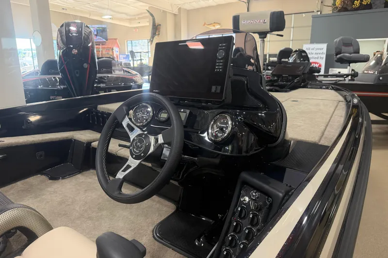 Slide: The Image of 2027 Phoenix 721 ZXL boat interior with steering wheel and control panel. - 8