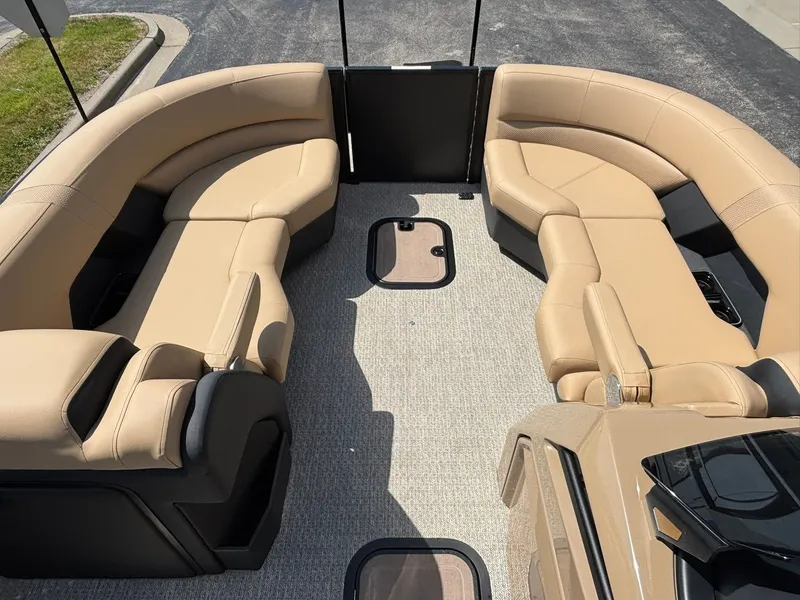 Slide: The Image of Interior of the 2027 Evotti 723 CS with beige leather seating and carpeted floor. - 12