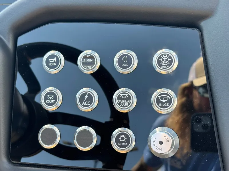 Slide: The Image of Close-up of a boat control panel with various buttons for functions like horn and bilge. - 21