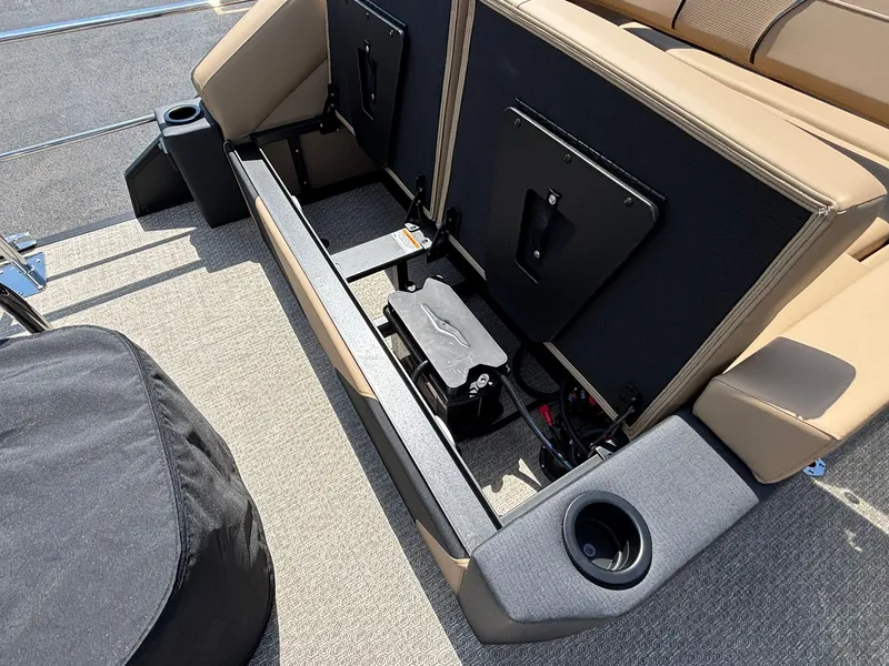 Slide: The Image of The image shows the storage area of a 2027 Evotti 723 CS boat with beige upholstery. - 28