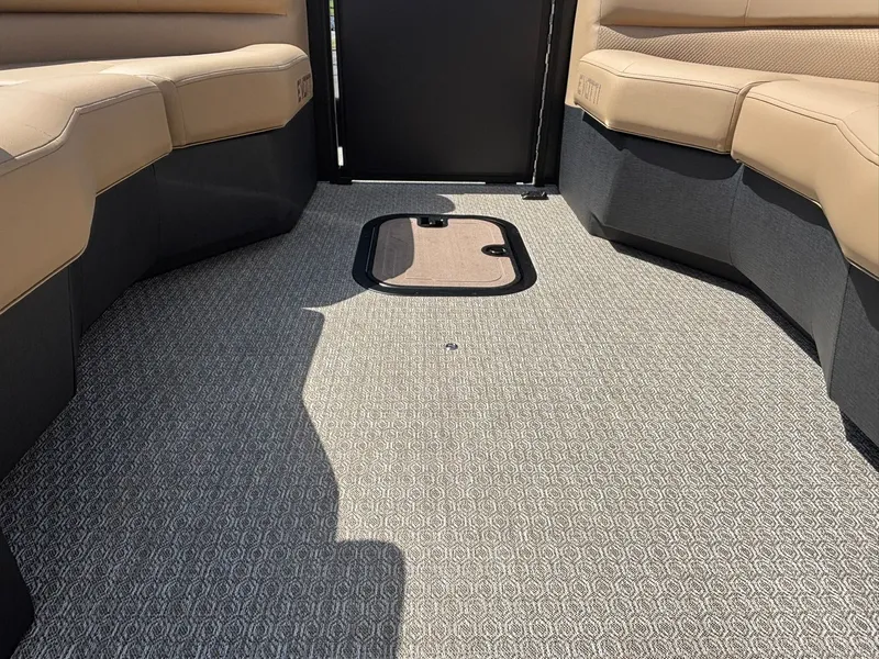 Slide: The Image of Interior of a 2027 Evotti 723 CS with beige seating and carpeted floor. - 13