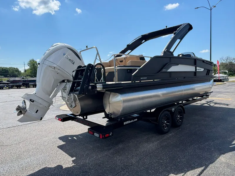 Slide: The Image of The image shows an Evotti 723 CS pontoon boat on a trailer. It features a large outboard motor. - 6