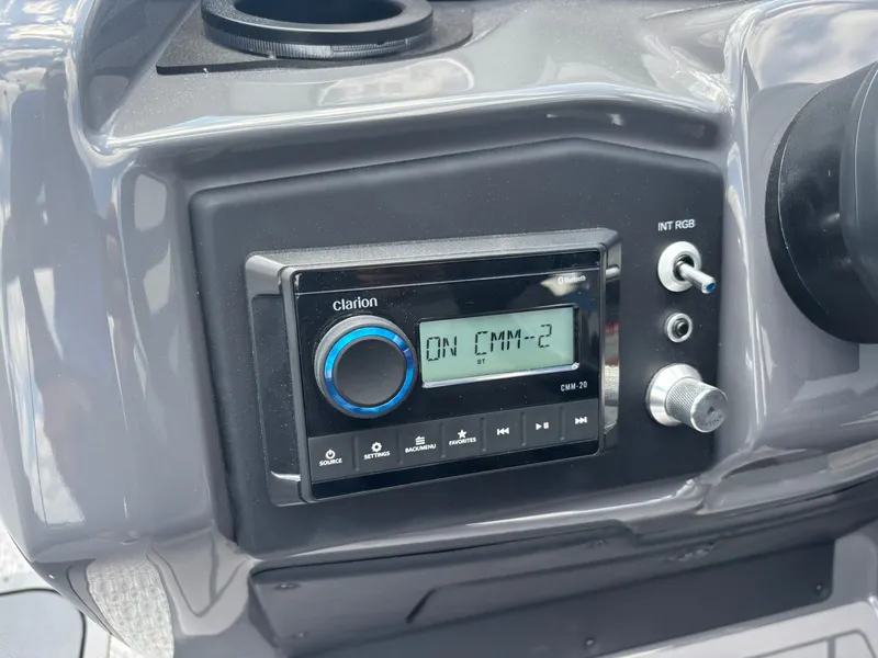 Slide: The Image of The image shows a Clarion audio system on a boat panel. - 21