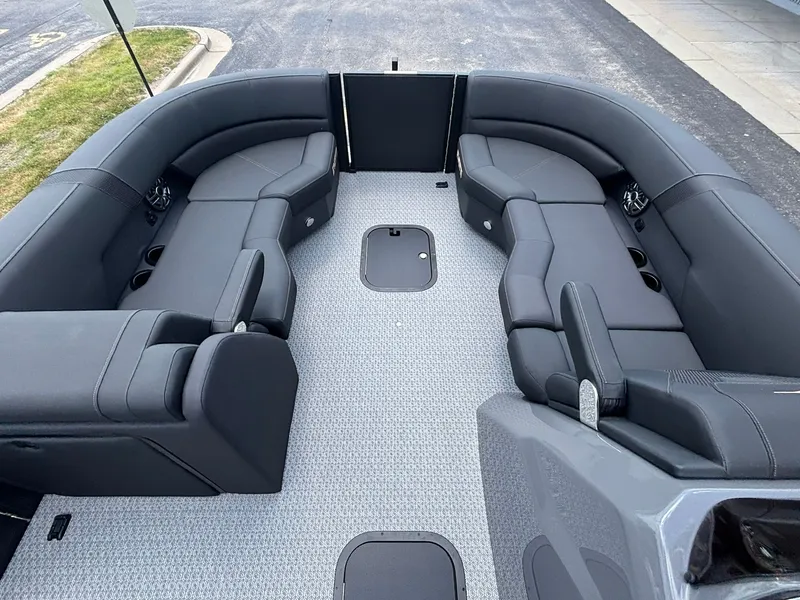 Slide: The Image of Evotti 521 QL 2027: Spacious, modern deck with gray upholstered seating and carpeted flooring. - 13