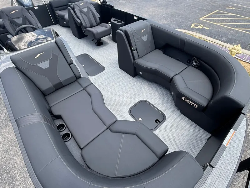 Slide: The Image of The image shows the interior of a 2027 Evotti 521 QL boat with sleek black seating. - 10
