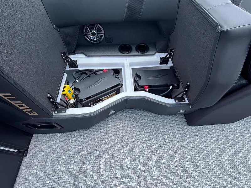 Slide: The Image of Battery compartment in the 2027 Evotti 521 QL boat, featuring two batteries and a speaker. - 29