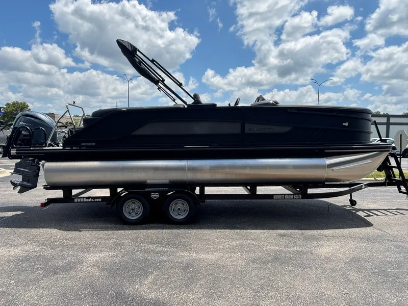 Slide: The Image of Evotti 521 QL 2027: Sleek black pontoon boat on a trailer, featuring dual outboard engines. - 5