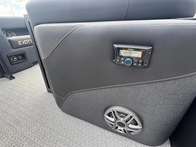 Slide: The Image of Interior of a 2027 Evotti 521 QL with gray upholstery and built-in speaker. - 32