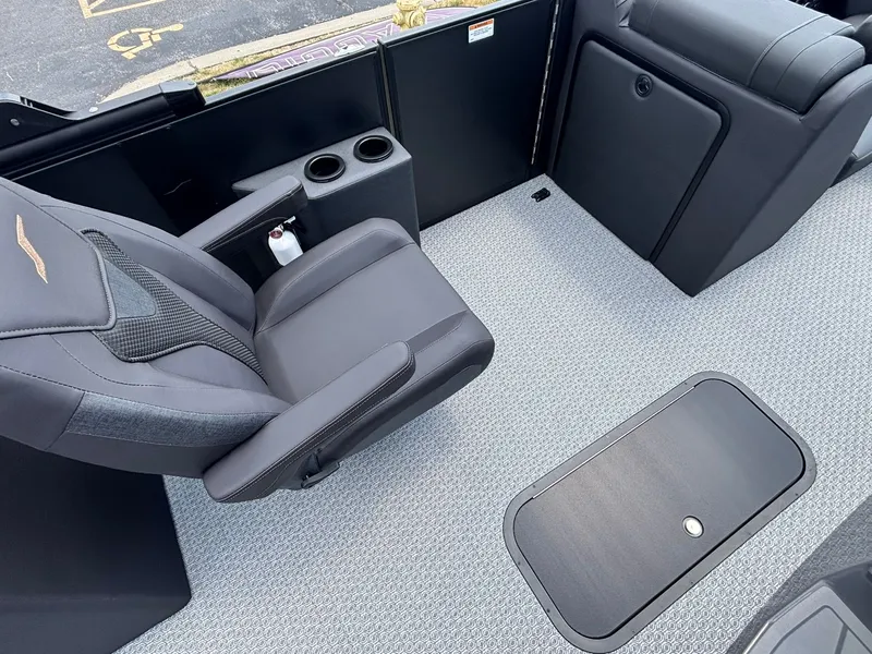Slide: The Image of Interior of a 2027 Evotti 521 QL with gray seating and carpeted flooring. - 17