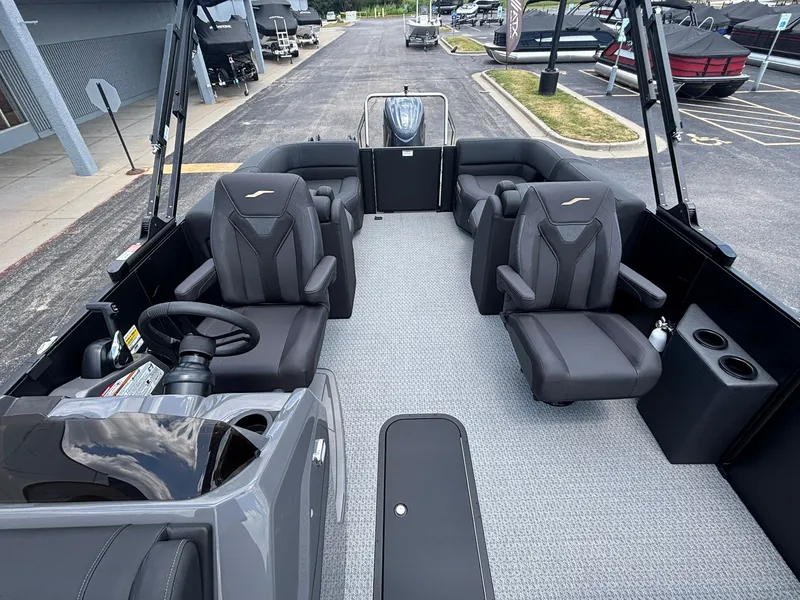 Slide: The Image of The image shows the interior of a 2027 Evotti 521 QL boat with modern black seating. - 16