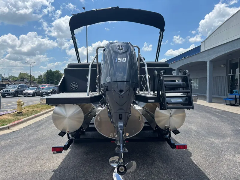 Slide: The Image of Evotti 521 QL 2027: Rear view of a pontoon boat with outboard motor and sunshade. - 7