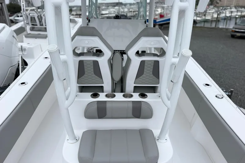 Slide: The Image of 2026 Cape Horn 28XS boat interior with modern seating and cup holders. - 7
