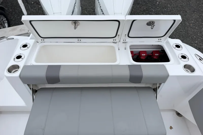 Slide: The Image of 2026 Cape Horn 28XS boat with open storage compartments and seating area. - 6