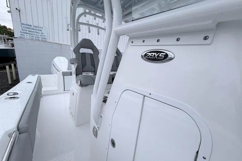 Slide: The Image of 2026 Cape Horn 28XS boat interior with seating and console details. - 15