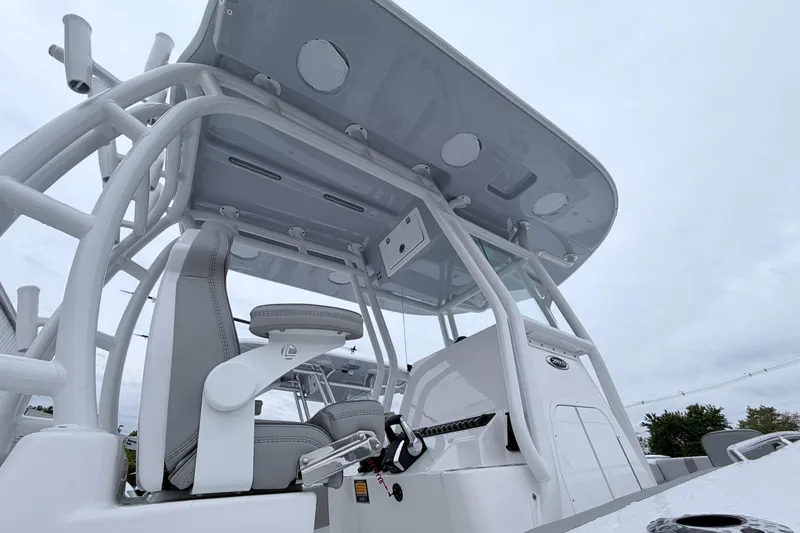 Slide: The Image of 2026 Cape Horn 28XS boat interior with modern seating and control panel. - 2