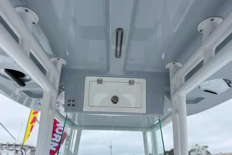 Slide: The Image of Interior view of 2026 Cape Horn 28XS boat, showcasing sleek design and storage compartment. - 12