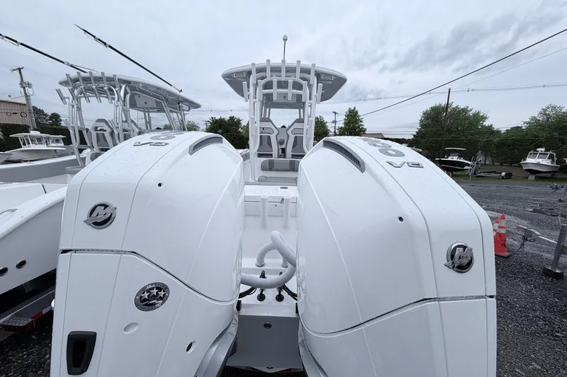 Slide: The Image of 2026 Cape Horn 28XS boat with dual V8 engines, showcased outdoors. - 3